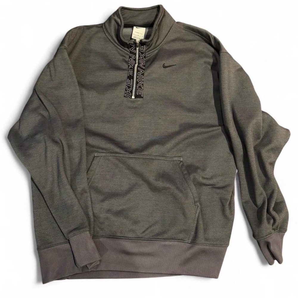 Nike Woman’s Charcoal pull over.